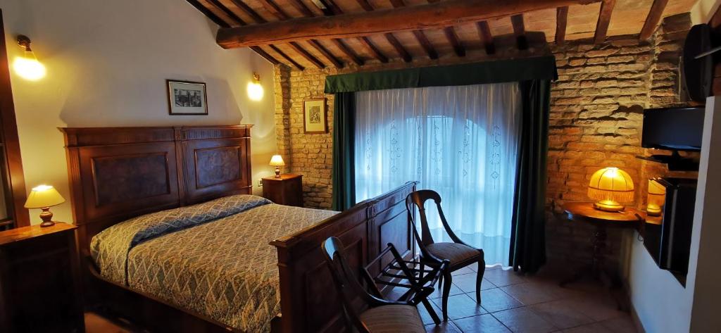 Posteľ alebo postele v izbe v ubytovaní Agriturismo-R&B Corte dei Gioghi