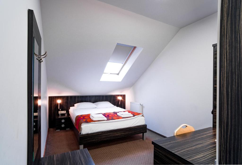 Postel nebo postele na pokoji v ubytování Hotel Sulbin