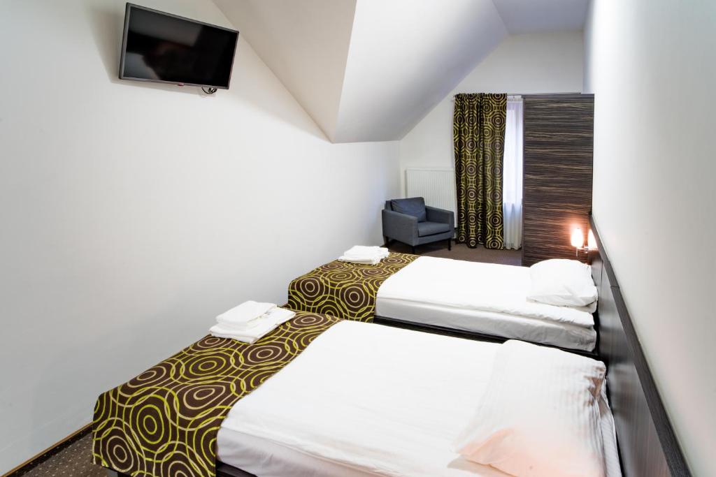 Postel nebo postele na pokoji v ubytování Hotel Sulbin