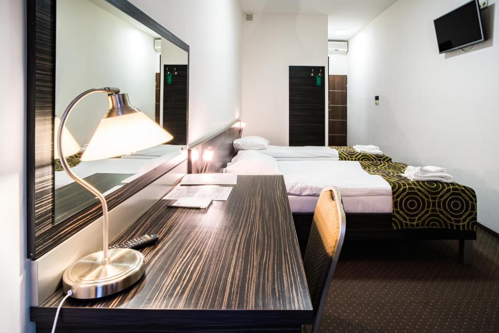 Postel nebo postele na pokoji v ubytování Hotel Sulbin