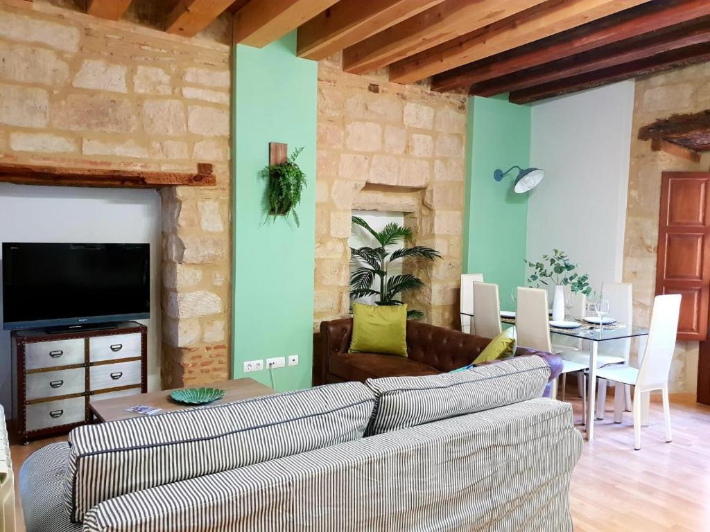 a living room with a couch and a table at Centro Historico Universidad LA RANITA SALMANTINA in Salamanca