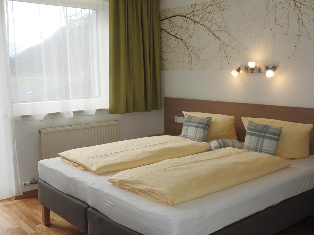 Postel nebo postele na pokoji v ubytování Pension Elmerhof