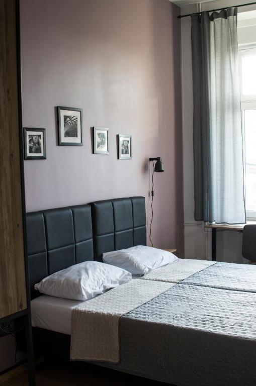 Postel nebo postele na pokoji v ubytování K43 Rooms