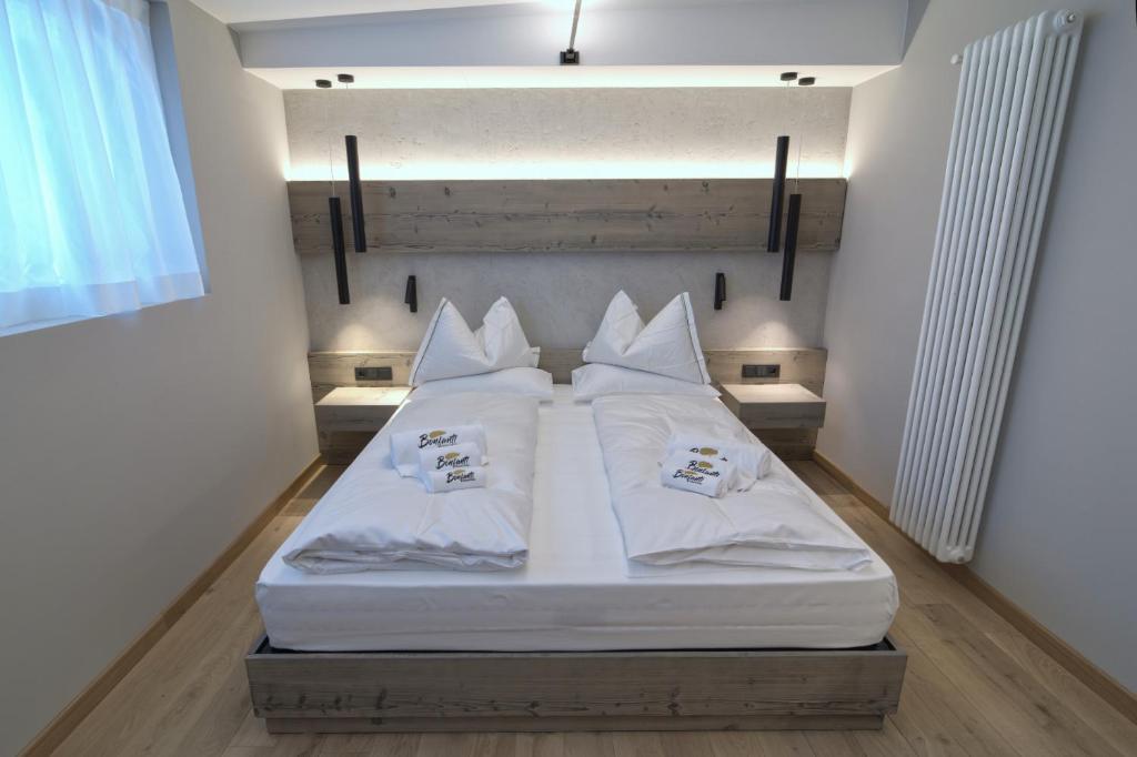 Postel nebo postele na pokoji v ubytování Bonfanti Design Hotel