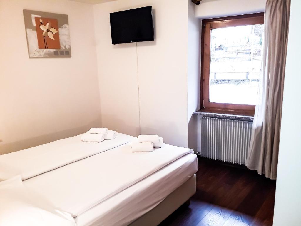 Postel nebo postele na pokoji v ubytování Sas da Rocia by go new location