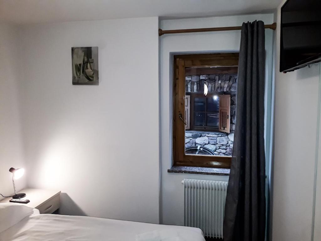 Postel nebo postele na pokoji v ubytování Sas da Rocia by go new location