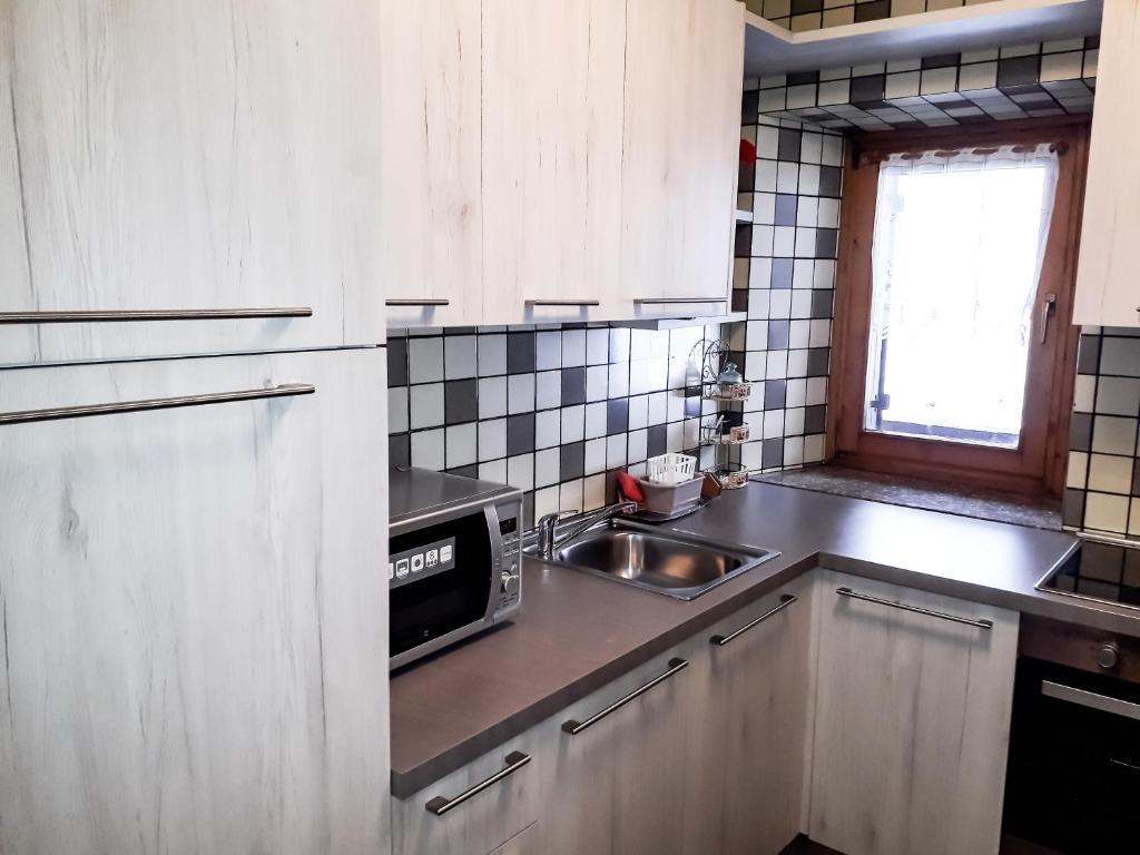 Kuchyň nebo kuchyňský kout v ubytování Sas da Rocia by go new location