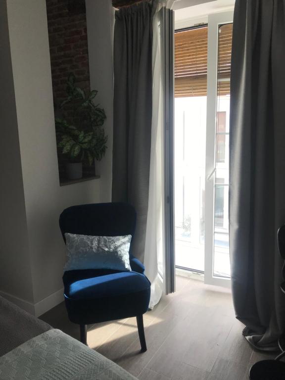 A seating area at Apartamentos DUKE