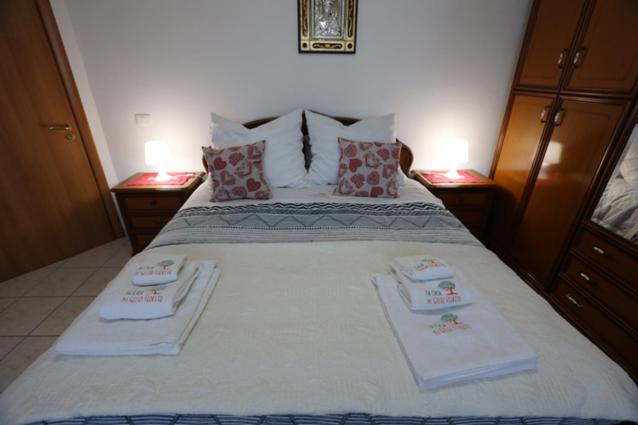 A bed or beds in a room at La Casa del Gelso Fiorito