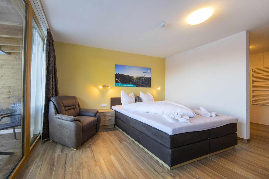 Postel nebo postele na pokoji v ubytování Hotel Krimml