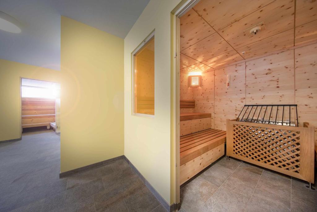 Postel nebo postele na pokoji v ubytování Hotel Krimml