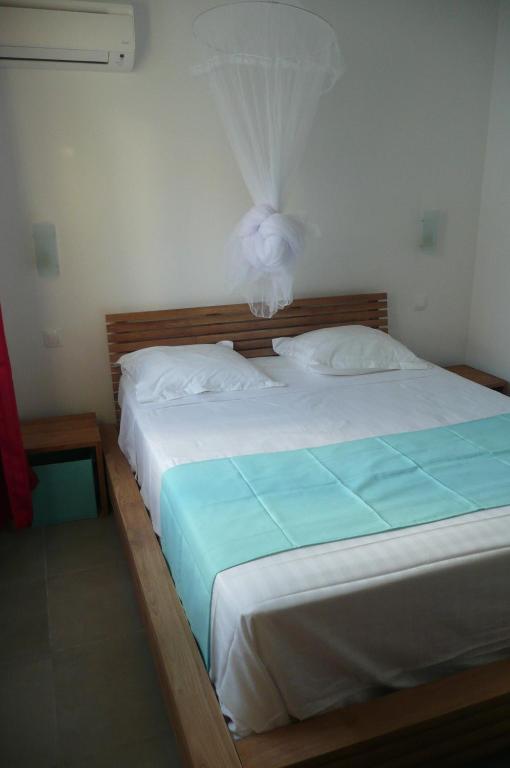 Postel nebo postele na pokoji v ubytování Douceurs Caraïbes, Gîte Balisier.