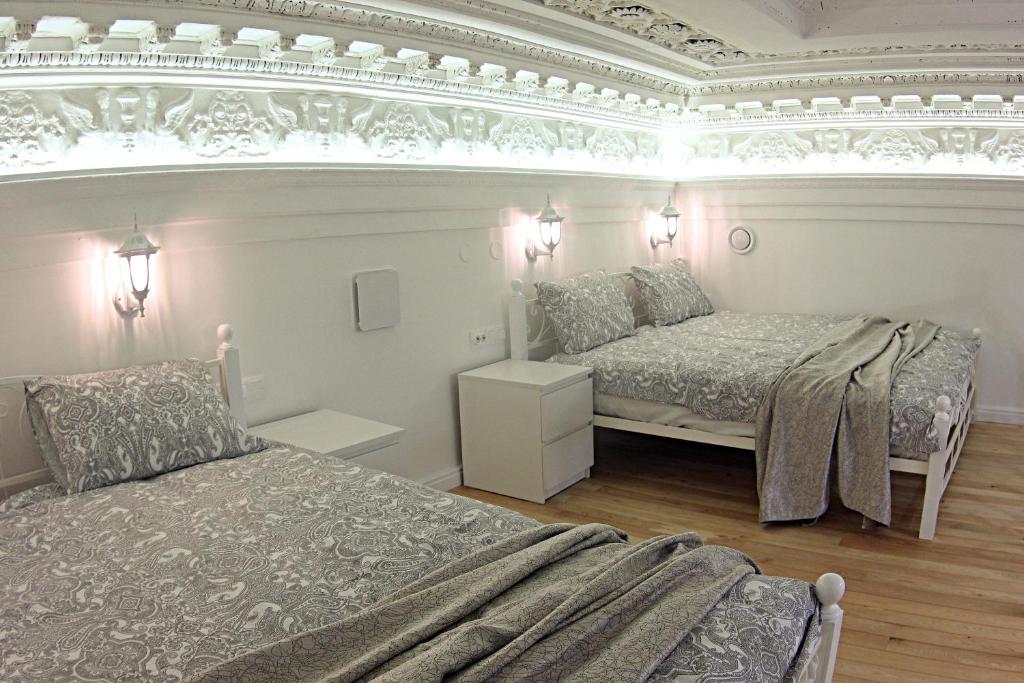 Кровать или кровати в номере Апартаменты "Антресоль"
