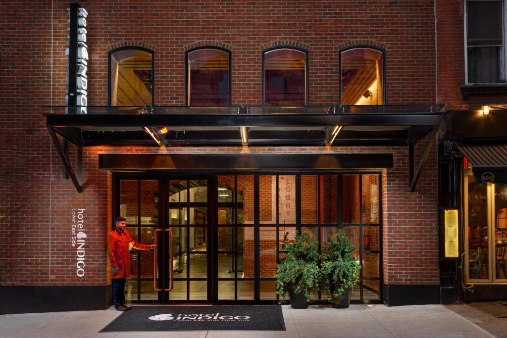 a person standing in the doorway of a building at Hotel Indigo Lower East Side New York in New York