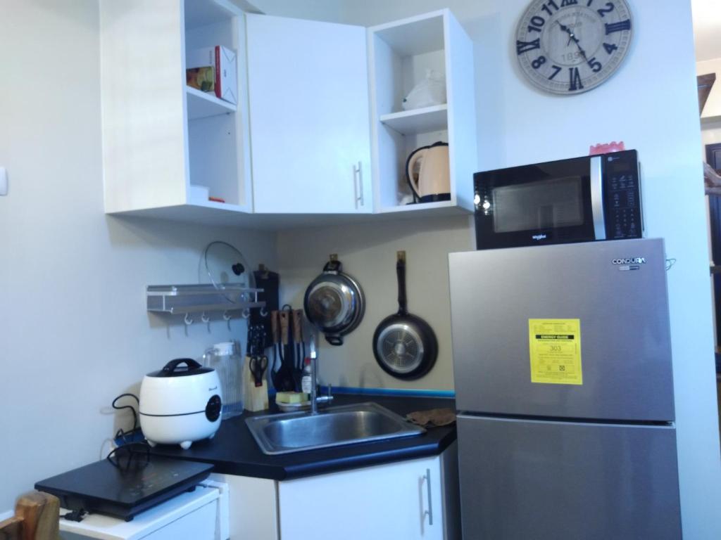 Kuchyň nebo kuchyňský kout v ubytování Avida Atria Khalexa's Place Iloilo