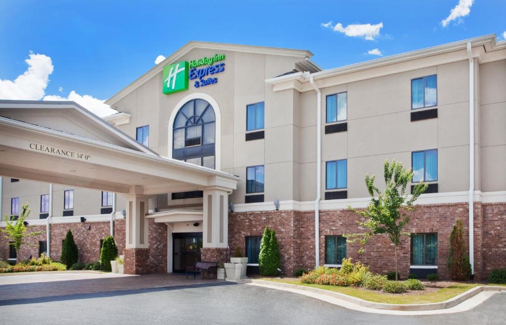 a large building with a sign on the front of it at Holiday Inn Express Hotel & Suites Austell Powder Springs, an IHG Hotel in Austell