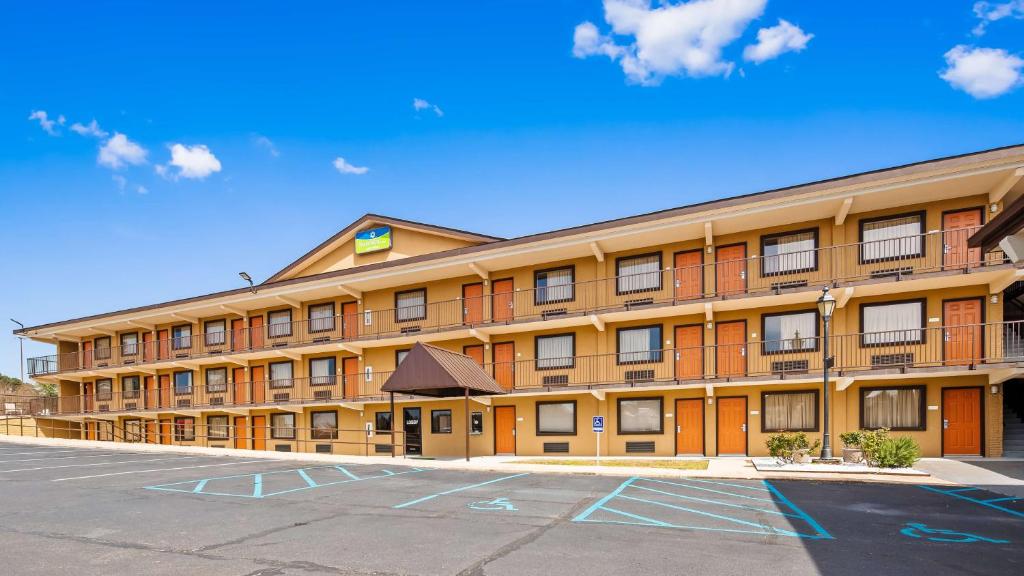 an empty parking lot in front of a hotel at SureStay Hotel by Best Western Tupelo North in Tupelo