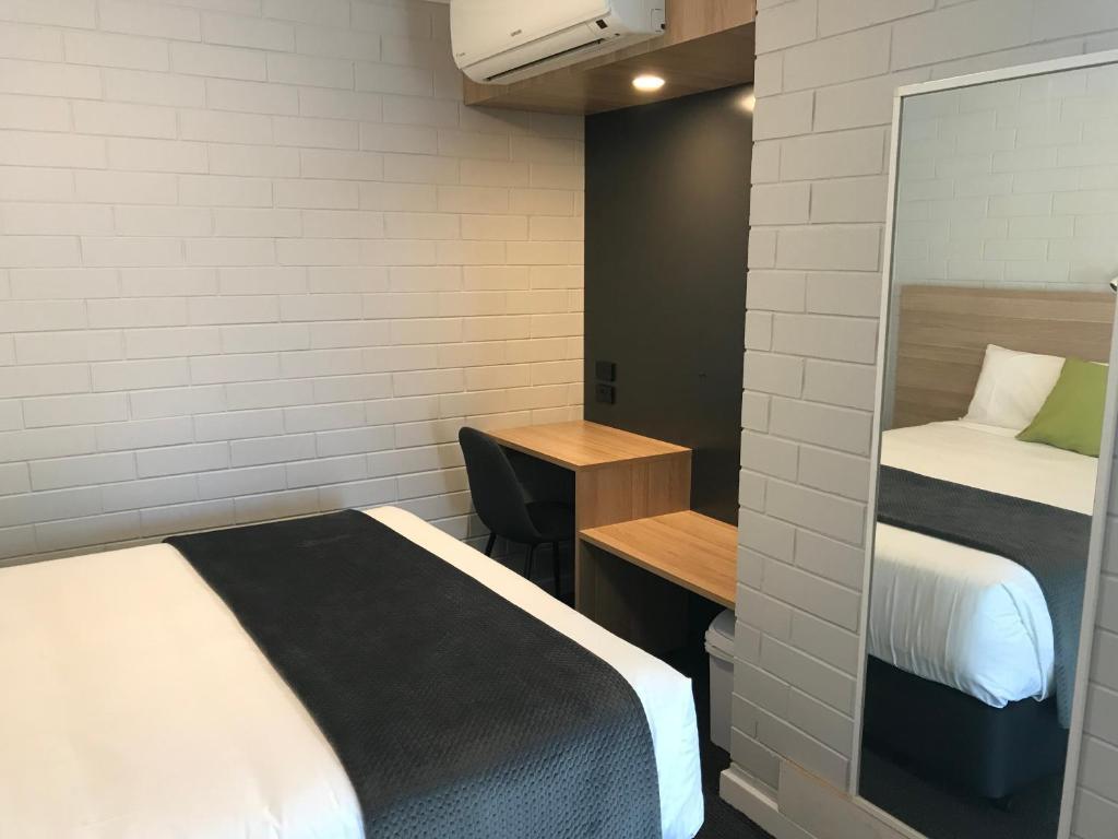 Postel nebo postele na pokoji v ubytování Frewville Motor Inn