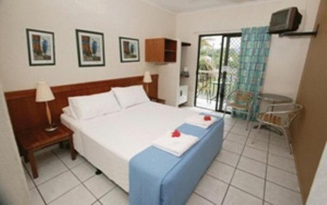 Postel nebo postele na pokoji v ubytování Bohemia Resort Cairns