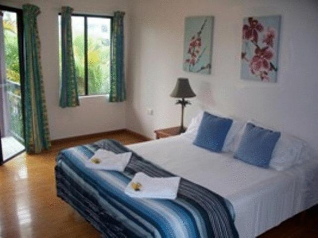 Postel nebo postele na pokoji v ubytování Bohemia Resort Cairns