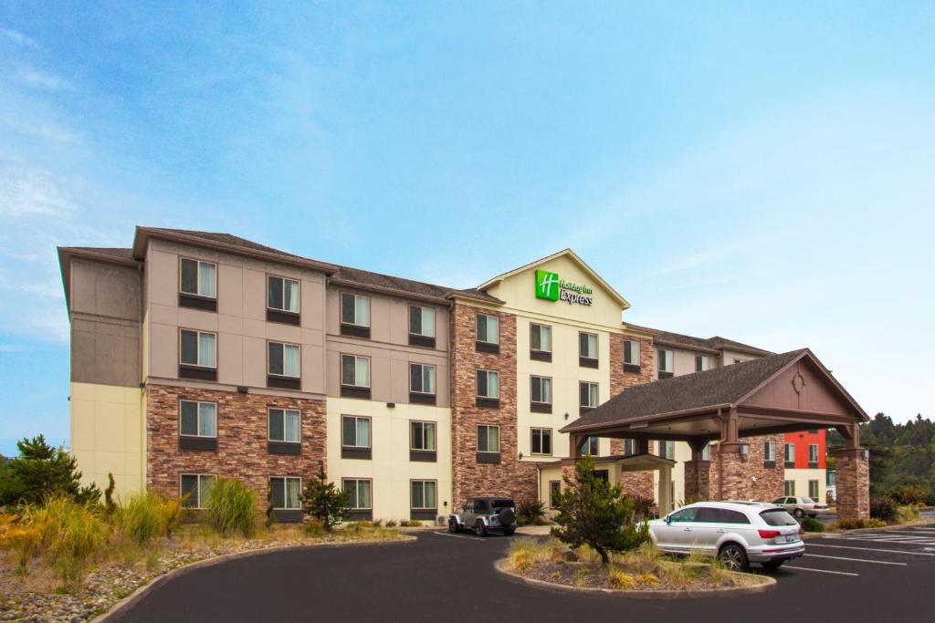 a hotel with a car parked in a parking lot at Holiday Inn Express Newport, an IHG Hotel in Newport