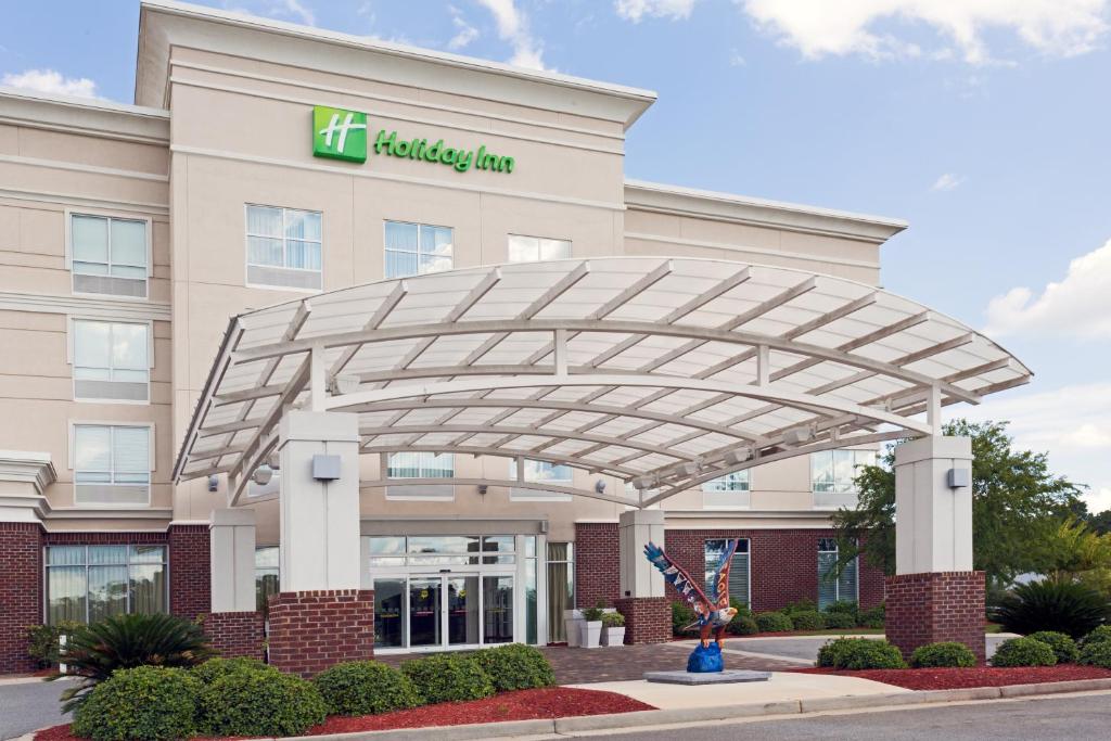 a hospital building with awning in front of it at Holiday Inn Statesboro-University Area by IHG in Statesboro