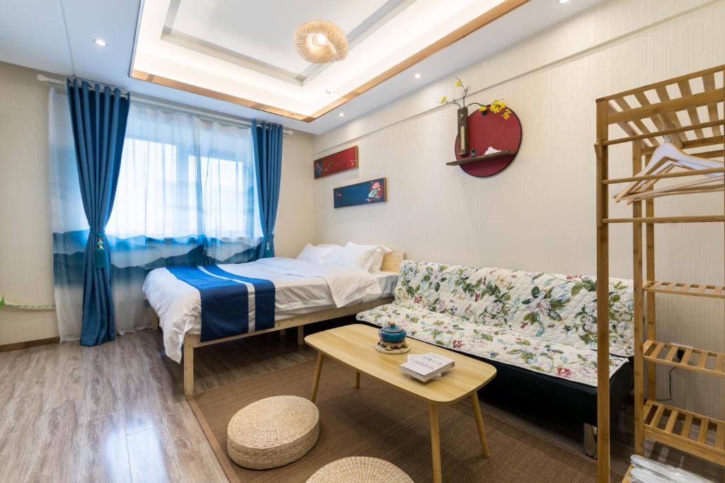 Postel nebo postele na pokoji v ubytování Yu Jing Xuan Boutique Apartment