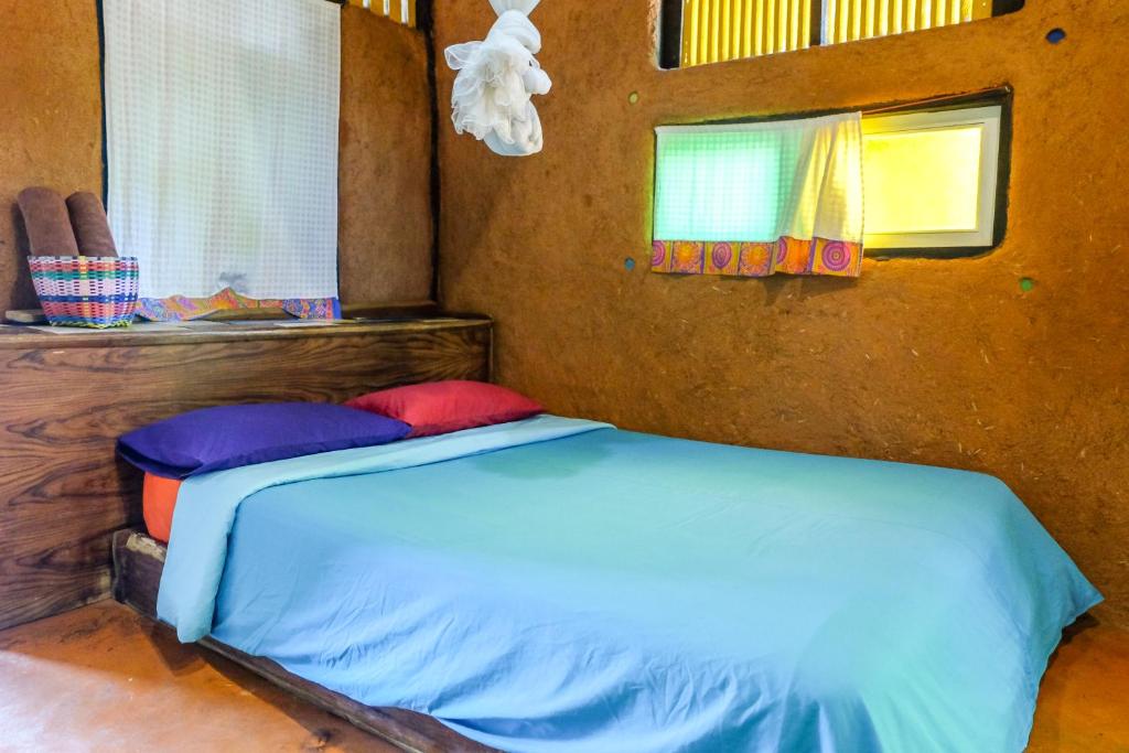 Postel nebo postele na pokoji v ubytování Sawasdeepai River Resort