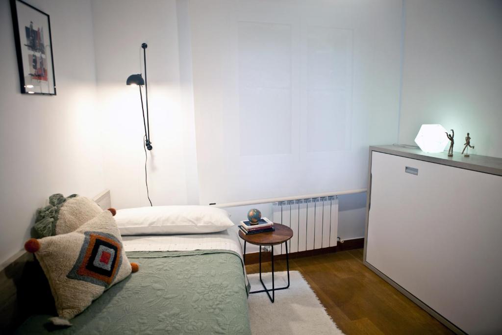 Postel nebo postele na pokoji v ubytování ZUBIGANE apartamento junto a la Ría & Parking