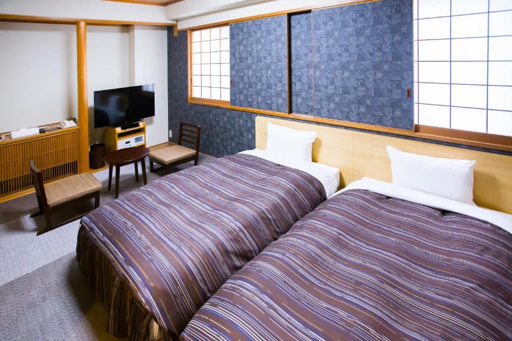 Postel nebo postele na pokoji v ubytování Ark Hotel Okayama -ROUTE INN HOTELS-