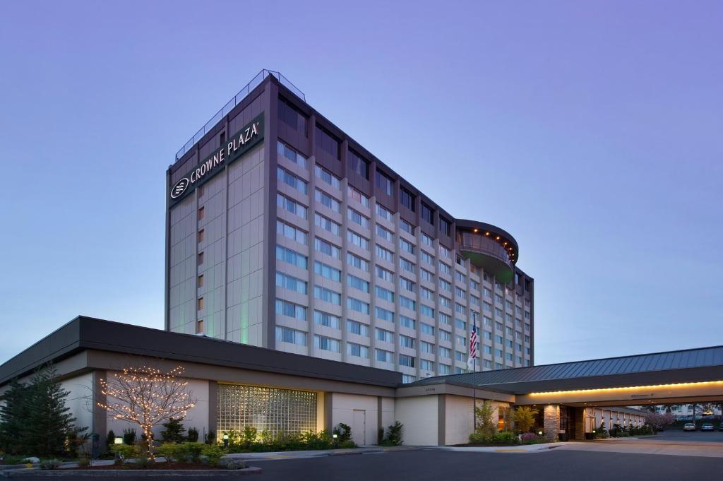 a large building with a large clock on it at Crowne Plaza Seattle Airport, an IHG Hotel in SeaTac