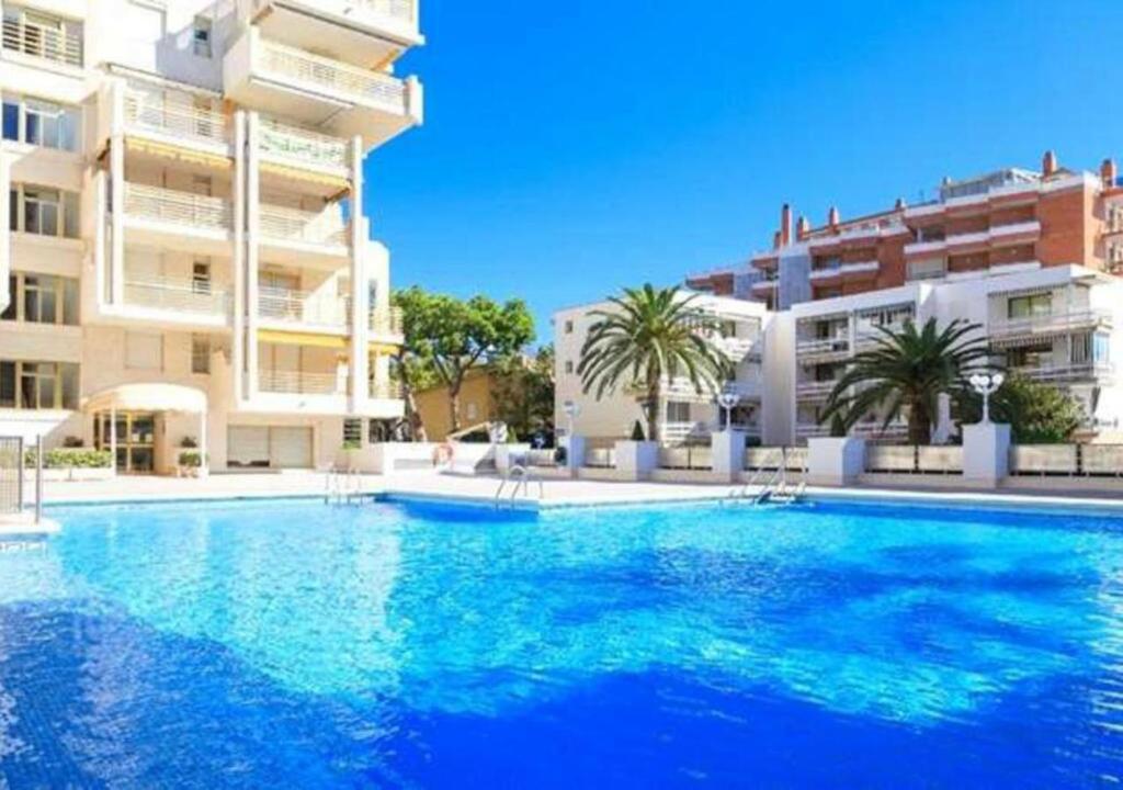 a large swimming pool in front of some buildings at Novelty I in Salou