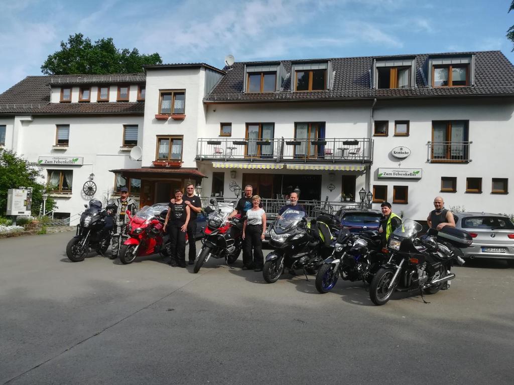 a group of motorcycles parked in front of a building at Waldpension zum Felsenkeller in Lichtenfels-Sachsenberg