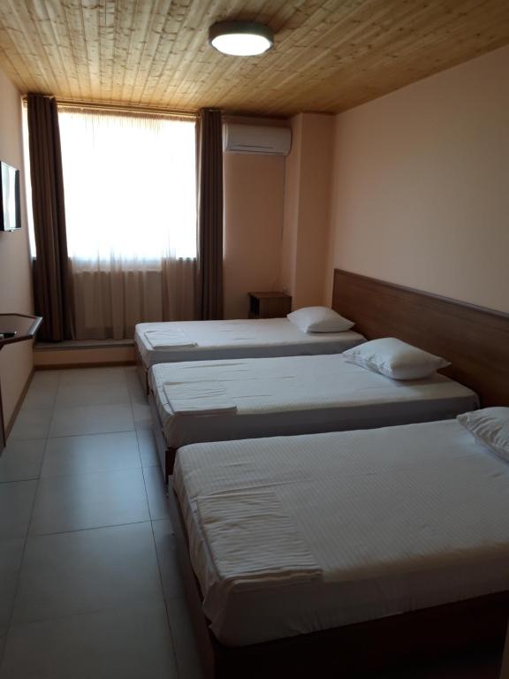 Postel nebo postele na pokoji v ubytování Zedazeni Hotel