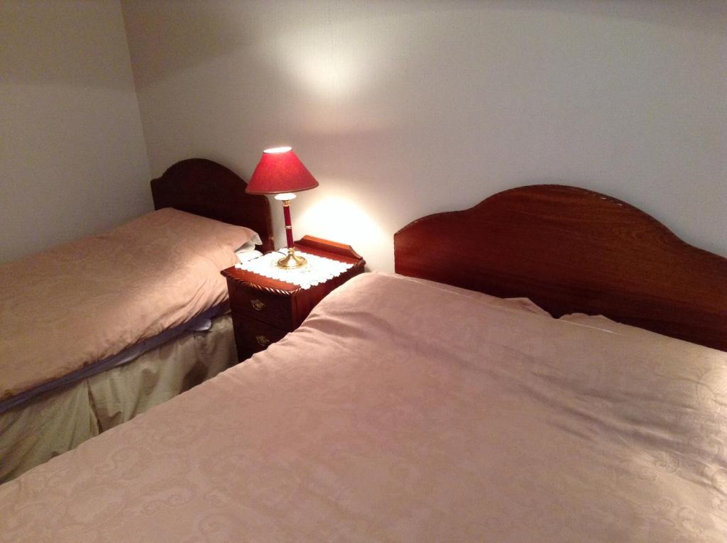 Postel nebo postele na pokoji v ubytování Rodini B&B