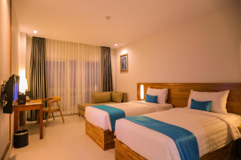 Postel nebo postele na pokoji v ubytování Pollos Hotel & Gallery