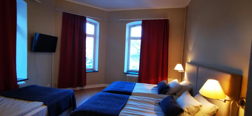 Postel nebo postele na pokoji v ubytování Sundsvall City Hotel