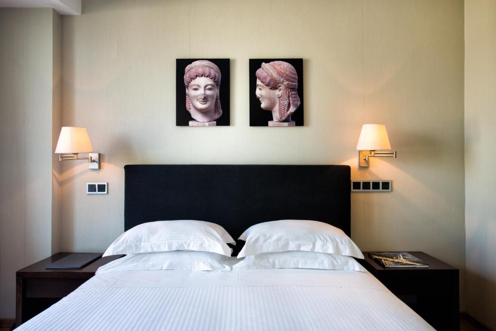 Posteľ alebo postele v izbe v ubytovaní The Athens Gate Hotel