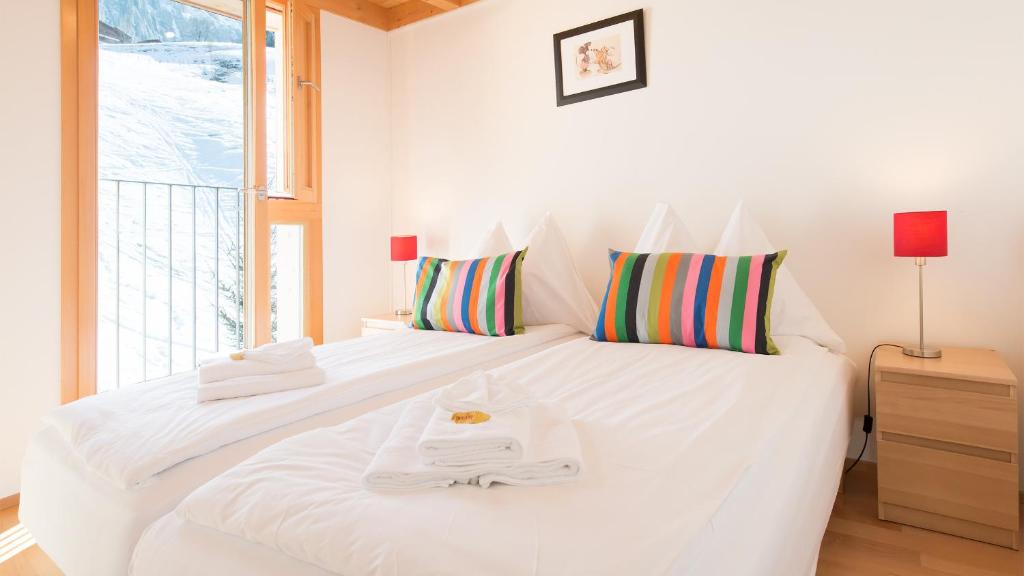 Postel nebo postele na pokoji v ubytování Chalet Roossi