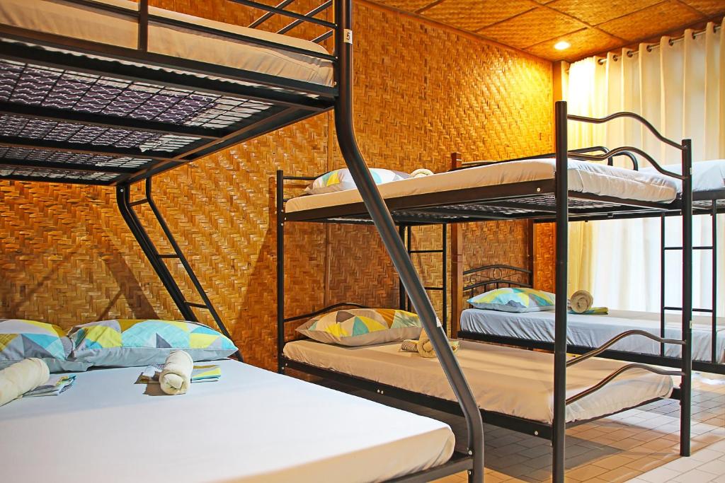 Postel nebo postele na pokoji v ubytování 1888 Beach Resort