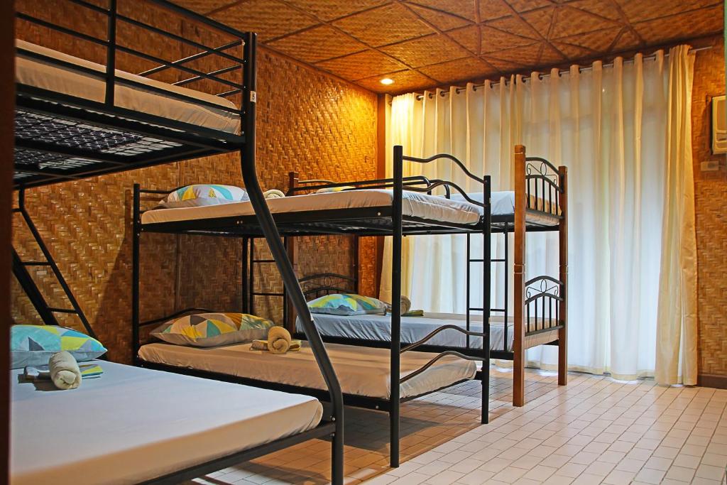 Postel nebo postele na pokoji v ubytování 1888 Beach Resort