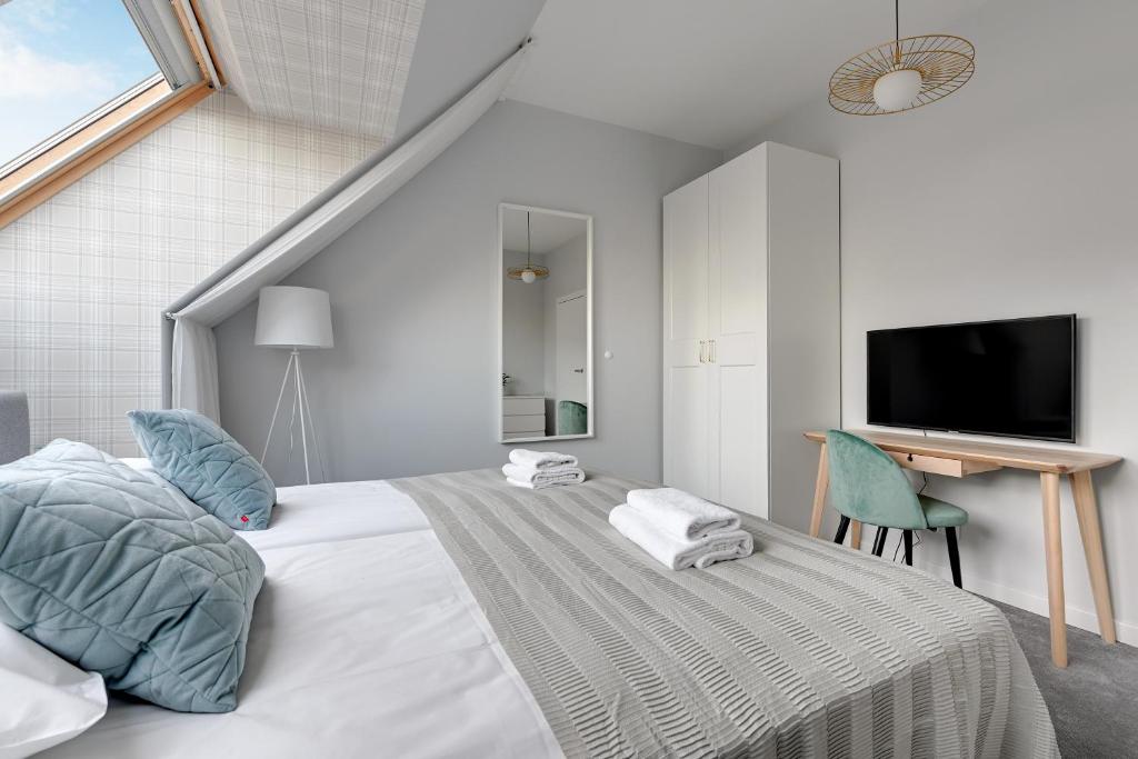 Posteľ alebo postele v izbe v ubytovaní GRANO APARTMENTS Gdańsk Motława SPA & Wellness