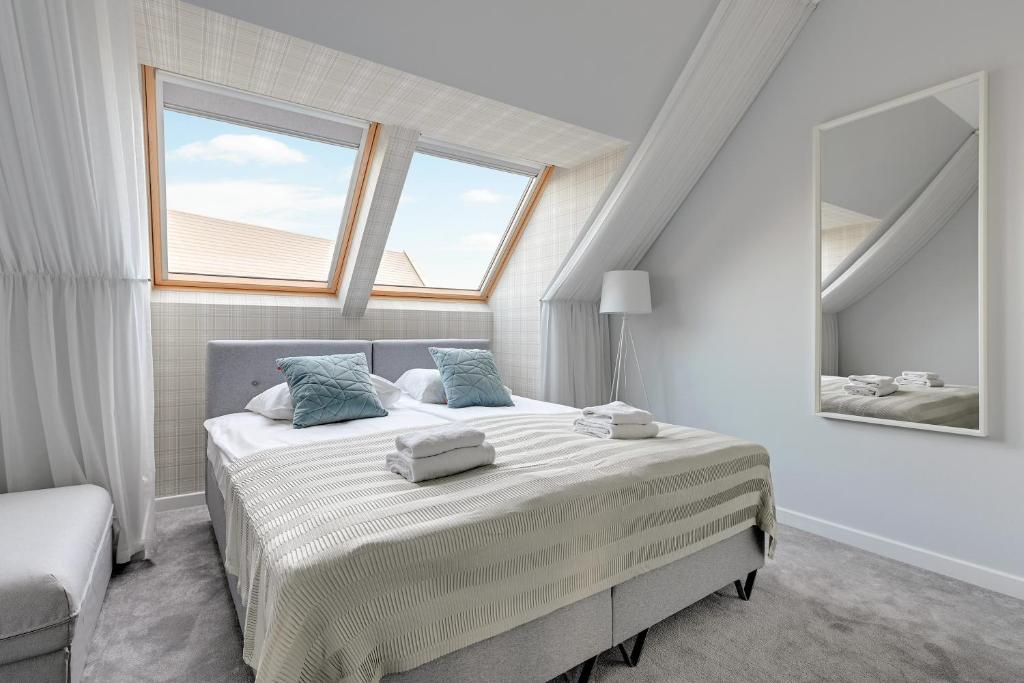 Posteľ alebo postele v izbe v ubytovaní GRANO APARTMENTS Gdańsk Motława SPA & Wellness