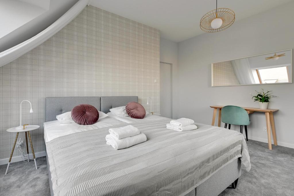 Posteľ alebo postele v izbe v ubytovaní GRANO APARTMENTS Gdańsk Motława SPA & Wellness