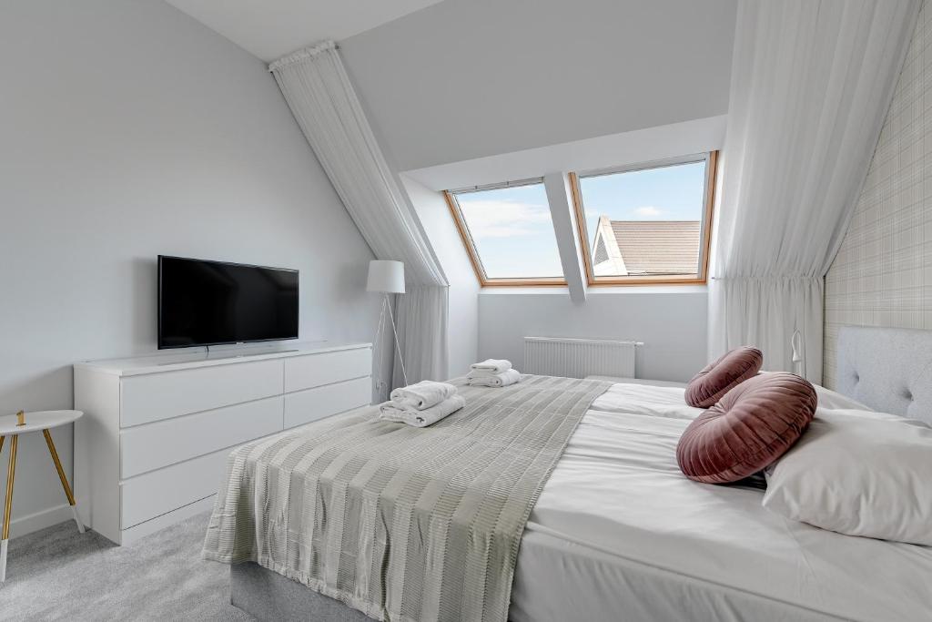 Posteľ alebo postele v izbe v ubytovaní GRANO APARTMENTS Gdańsk Motława SPA & Wellness