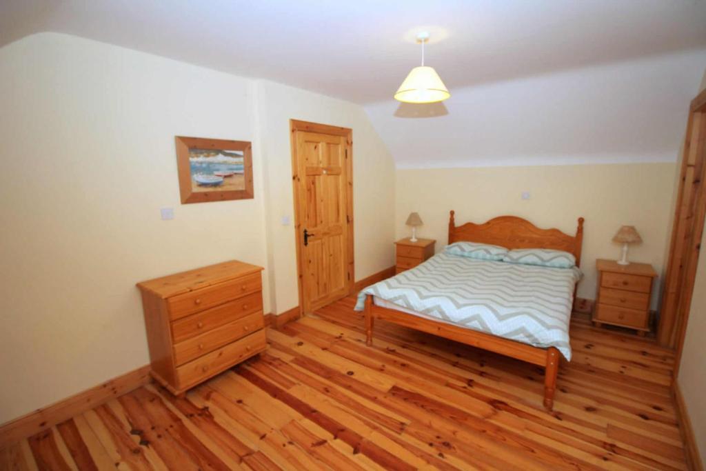 Postel nebo postele na pokoji v ubytování Rathmullan Holiday Homes