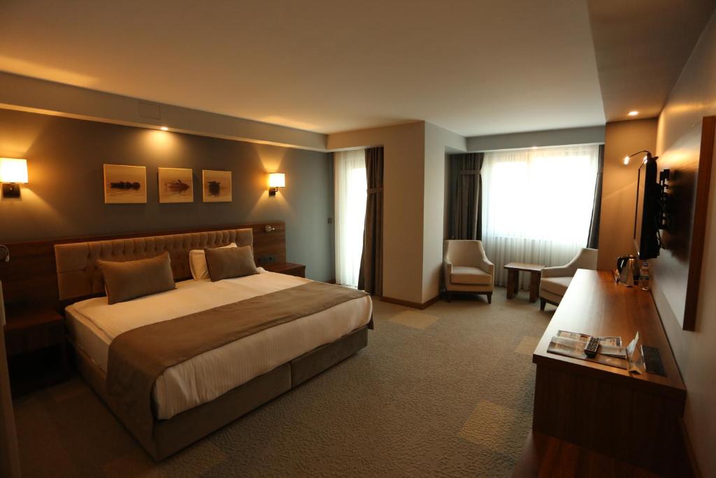 Postel nebo postele na pokoji v ubytování Oytun Park Hotel