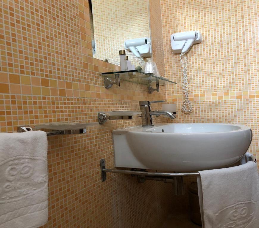 Koupelna v ubytování Le Cheminée Business Hotel Napoli