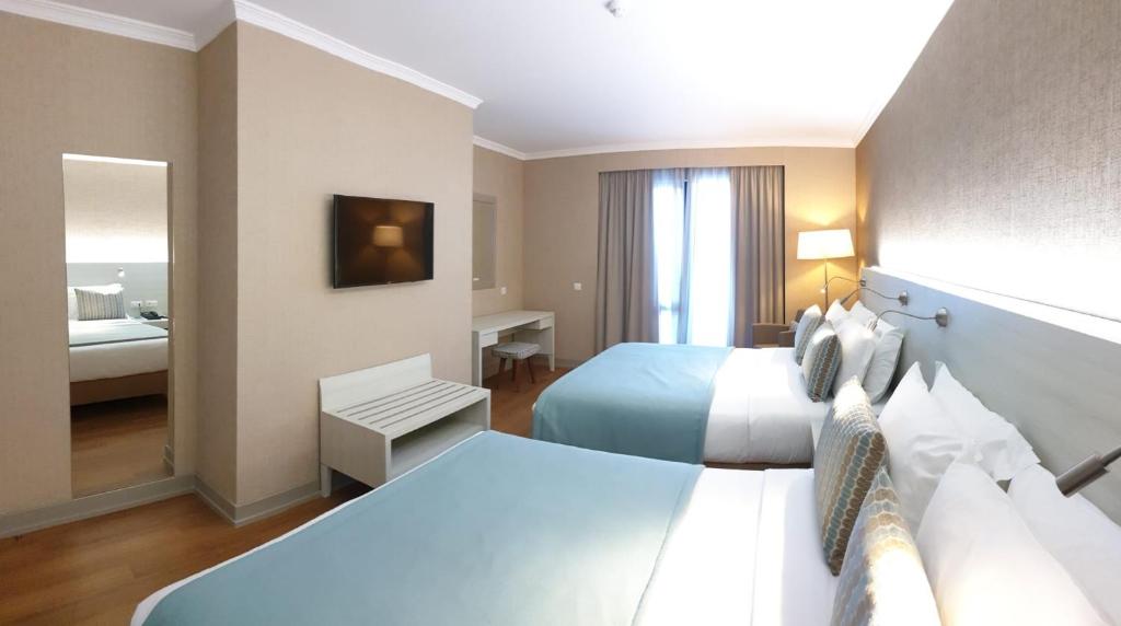 Postel nebo postele na pokoji v ubytování Enotel Lido - All Inclusive