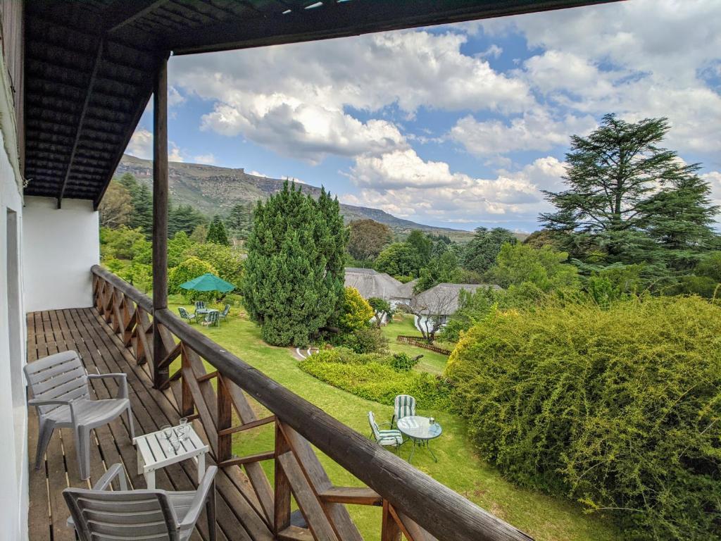 a balcony with a view of a garden at Wyndford Holiday Farm in Fouriesburg